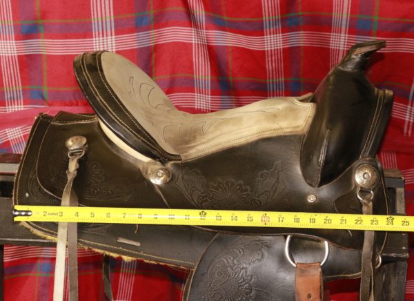 Right side of saddle with tape measure, reading 24 inches